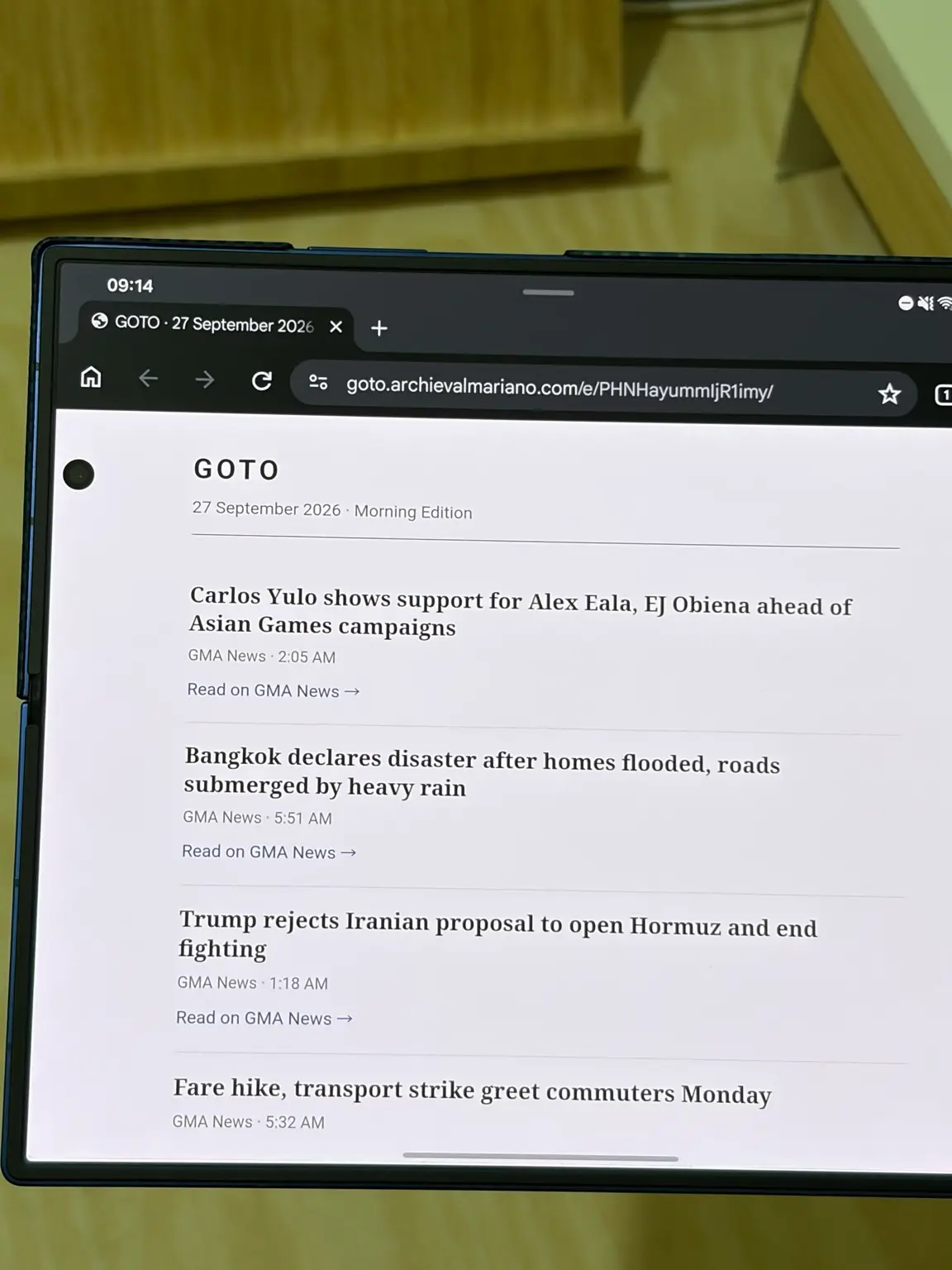 The GOTO morning edition page for 27 September 2026 open in a browser on a Samsung Galaxy Z Fold 7, listing the same stories with links to GMA News.