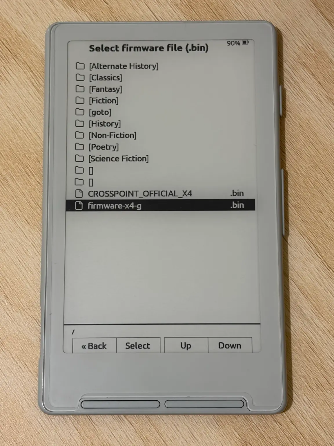 The firmware file picker on the XTEINK X4 with firmware-x4-g.bin selected, below CROSSPOINT_OFFICIAL_X4.bin.