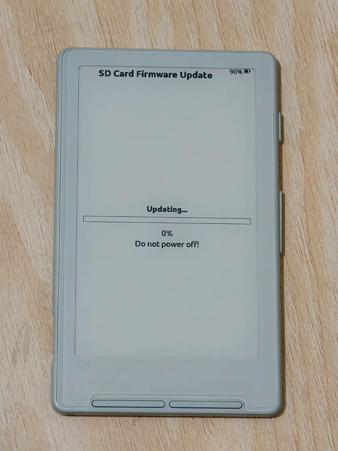 The XTEINK X4 SD Card Firmware Update screen showing Updating… 0% and Do not power off!